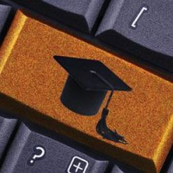 graduation cap on keyboard 