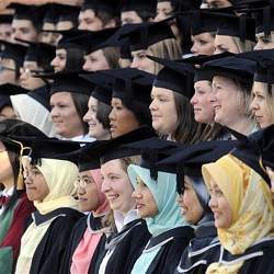 Women at a commencement ceremony. 