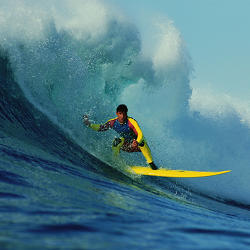 A surfer literally catching a wave. 