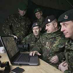 U.K. military personnel examine incoming cyber information. 