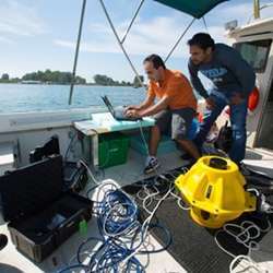 Doctoral candidates in Melodia's lab dropped two 40-pound sensors into the water and then typed a command into a laptop. 