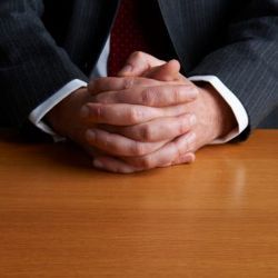 businessman's folded hands