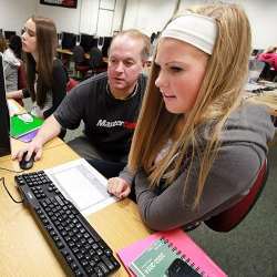 A U.S. high school student receiving technology and engineering instruction.