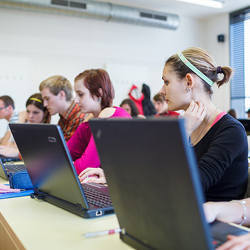 Young men and women at a hackathon.