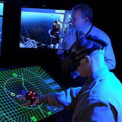 U.S. Navy personnel testing a virtual reality headset. 