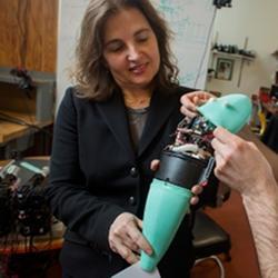 MIT CSAIL director Daniela Rus, with a soft robotic fish developed by MIT's Distributed Robotics Laboratory. 