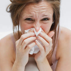 A woman suffering through the flu.
