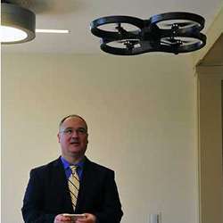 University of North Georgia computer science and information systems department head Bryson Payne controls a Parrot AR Drone 2.0 with a smartphone.