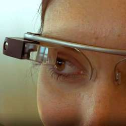 A woman using Google Glass.