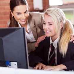 A computer science student working with her mentor.