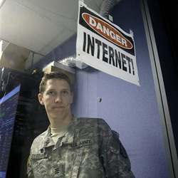 A cadet checks computers at the Cyber Research Center at the U.S. Military Academy in West Point, N.Y.,