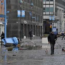 New Yorkers survey the destruction at South Street Seaport after Hurricane Sandy, which left large parts of the city without power. 