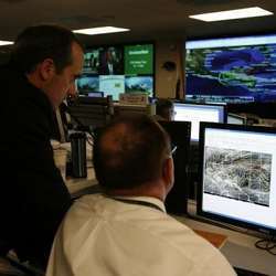 U.S. Department of Homeland Security analysts work at the National Cybersecurity & Communications Integration Center in Arlington, VA.