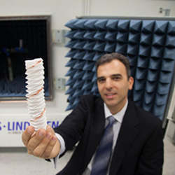 Stavros Georgakopoulos holds an origami-infused foldable antenna prototype.