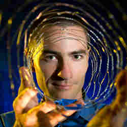 Sandia National Laboratories Francois Leonard holds a wire mesh cylinder similar in design to a carbon nanotube that might form the basis for future computing technology. 