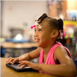 young student at keyboard