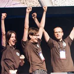 The triumphant Polish coding team of brothers Tomasz and Piotr Zurkowski and Wojciech Jaskowski.