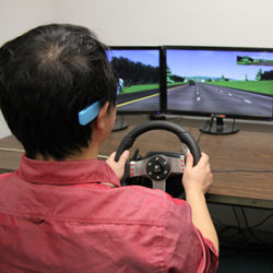 Jibo He at driving simulator