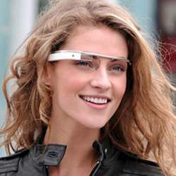 A young woman wearing a Google Glass prototype.
