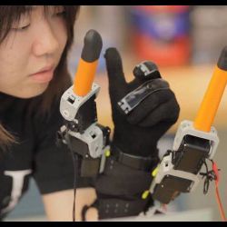 Faye Wu with robotic fingers