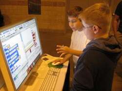 Young students learn how to code by using video games. 