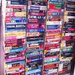 shelves of programming text books