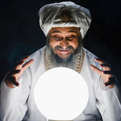 A fortuneteller looks to the future in his crystal ball.