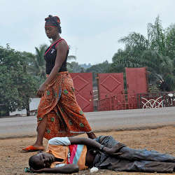 A woman in Monrovia, Liberia, passed a man believed to be infected with Ebola.