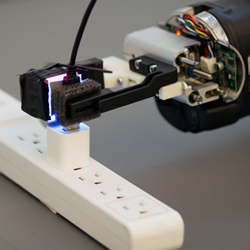 Armed with the GelSight sensor, a robot can grasp a freely hanging USB cable and plug it into a USB port.
