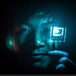 Jaesang Lee holding blue PHOLED