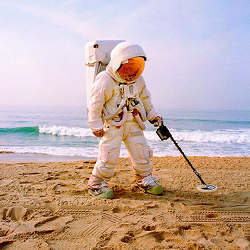 An astronaut on a beach.