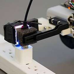 Armed with the GelSight sensor, a robot can grasp a freely hanging USB cable and plug it into a USB port.