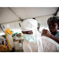 An aid worker prepares to deal with an Ebola-infected patient. 