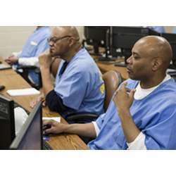 Inmate Nelson Butler, right, takes a coding class at San Quentin State Prison in San Quentin, CA.