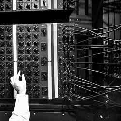 An ENIAC clerk registers information with banks of dials, at Aberdeen Proving Ground, 1947.