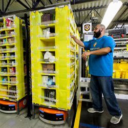 Amazon robot and fulfillment center employee 