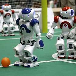 Robots playing soccer.