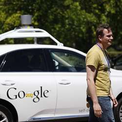 Googles Chris Urmson in front of a self-driving car. 