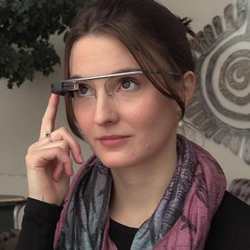 Researcher Natasha Jaques wears a pair of Google Glasses.