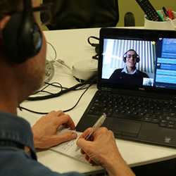 Sebastian Cuberos, on the laptop, demonstrated a newly announced Microsoft Skype program that simultaneously translated Spanish and English with his interviewer, seated at his desk, in San Francisco.