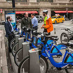 Cornell University professor David Shmoys, left, and graduate student Eoin O'Mahony discuss "rebalancing" with Citi Bike worker Kelly McGowan in New York City.