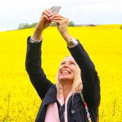 A woman snapping a selfie.