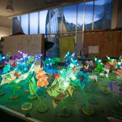 A robotic garden demonstrates distributed algorithms via more than 100 origami robots that can crawl, swim, and blossom like flowers.