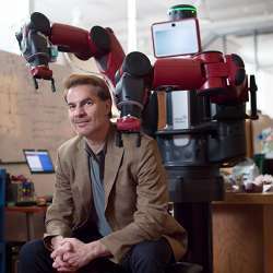 Massachusetts Institute of Technology Sloan School of Management professor Erik Brynjolfsson with a robot named Baxter.