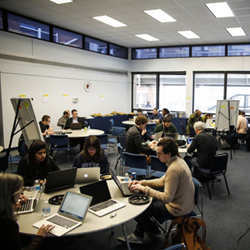 People working during the PATH Data Jam hackathon.