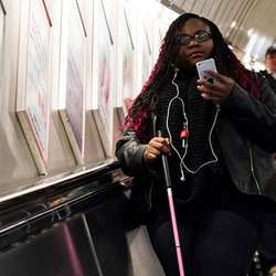 A visually impaired woman tests the Wayfinder app.