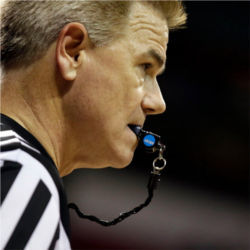 NCAA referee with whistle