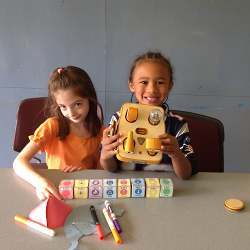 Kibo allows young tinkerers to build a robot using supplied modular components, personalize it with art designs and then program it to do their bidding using colored program blocks.