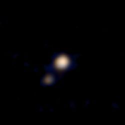 Pluto and moon Charon, in color
