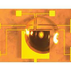 A gate electrode, coupled with a droplet of ionic liquid, controls a switch made from vanadium dioxide. The channel of the device is 200 micrometers long.